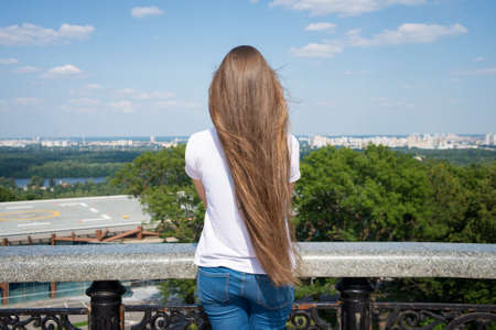 girl looking to beautiful cityscapeの写真素材