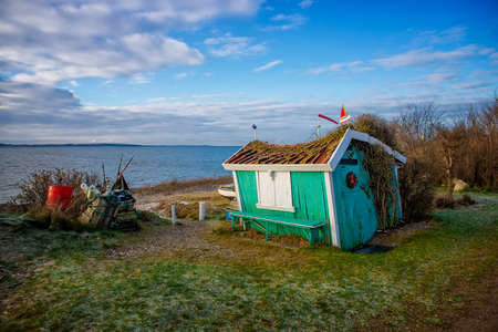 little old hut by the seaの写真素材