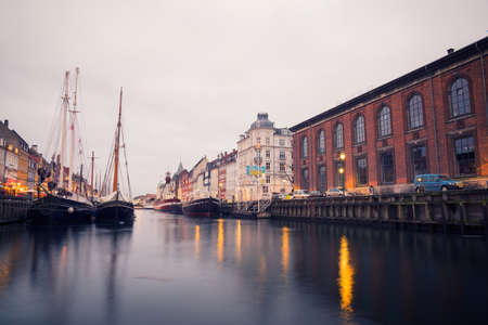 COPENHAGEN, DENMARK - 30 DECEMBER, 2014: Nyhavn is a 17th-century waterfront, canal and entertainment district in Copenhagen, Denmark. December 30, 2014 Copenhagen, Denmark.のeditorial素材