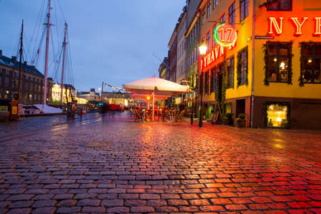 COPENHAGEN, DENMARK - 30 DECEMBER, 2014: Nyhavn is a 17th-century waterfront, canal and entertainment district in Copenhagen, Denmark. December 30, 2014 Copenhagen, Denmark.のeditorial素材