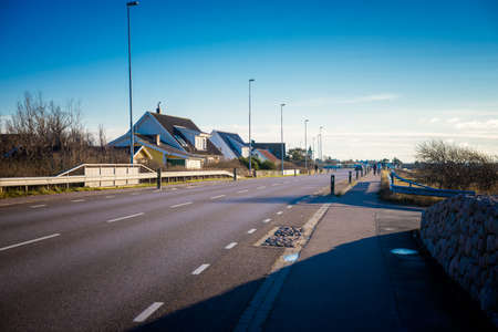 asphalt road in a small townの写真素材