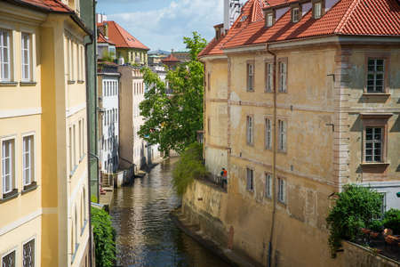 view from the Charles Bridge in the narrow channel in Pragueの写真素材