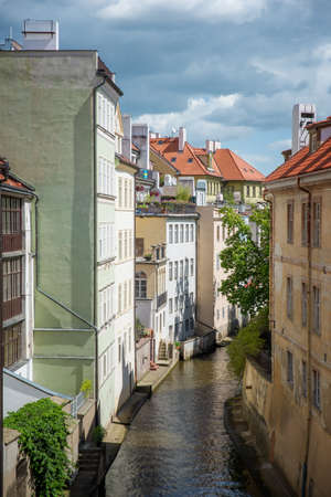 view from the Charles Bridge in the narrow channel in Pragueの写真素材