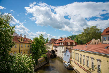 view from the Charles Bridge in the narrow channel in Pragueの写真素材