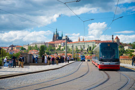 PRAGUE, CZECH REPUBLIC - MAY 6, 2015: Tram rides along the bridge that sees in the old town. May 6, 2015. Prague, Czech Republic.のeditorial素材