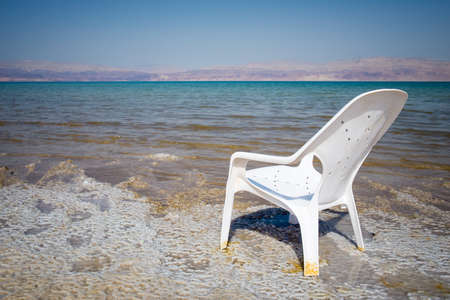 View of Dead Sea coastline and chairの写真素材