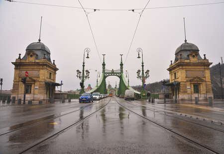 BUDAPEST, HUNGARY - MARCH 13, 2015: Cars driving on the Liberty bridgeのeditorial素材