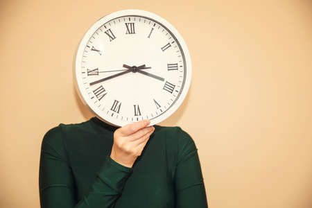 Clock instead of a headの写真素材