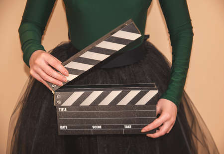 woman holding a clapperboardの写真素材
