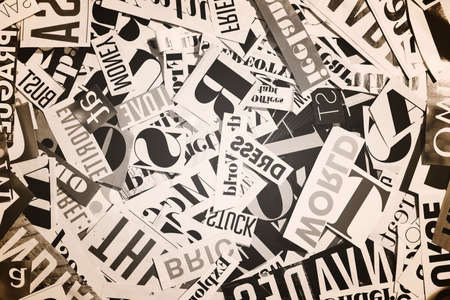 words cut from a magazine, abstract background with lettersの写真素材
