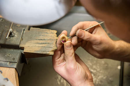 jeweler makes a piece of jewelryの写真素材