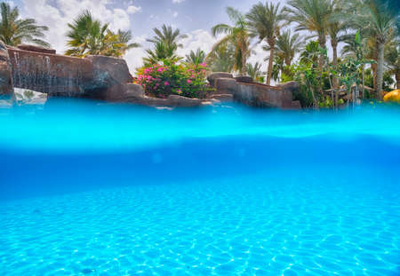 nice view of the swimming pool with waterfall
