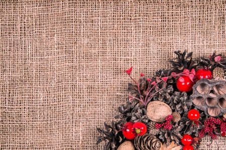Christmas wreath on an old brown cloth background