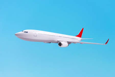 White passenger plane over blue backgroundの写真素材