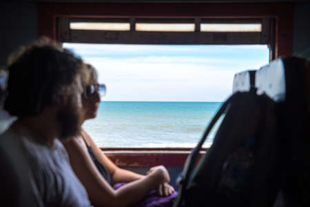 train rides along the the ocean shoreの写真素材