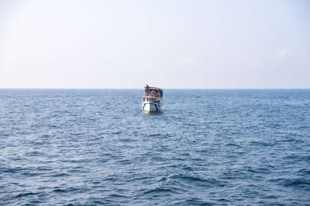 Ship with tourists watching the whales