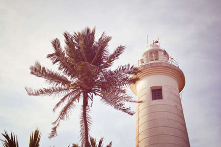lighthouse on the shores of the Indian Ocean in Galle, Sri Lankaの写真素材