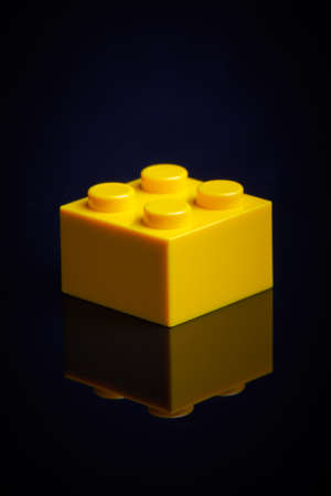 Yellow block of the designer on a black backgroundの写真素材