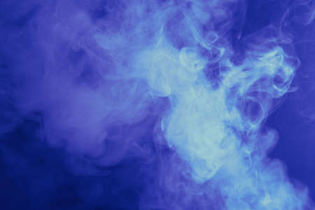 blue smoke on a dark backgroundの写真素材