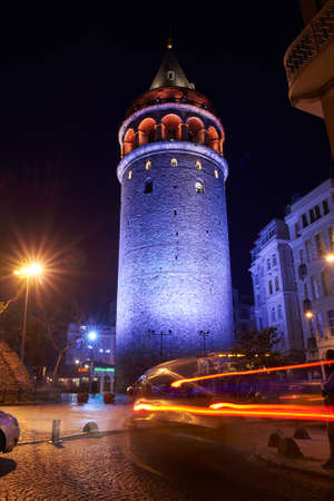 View of the Galata Tower in the historic district in Istanbul at nightの写真素材