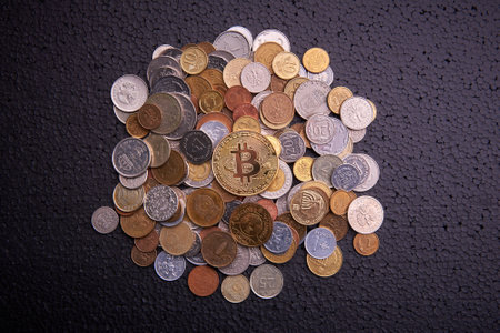 golden coin bitcoin  and other coins on black backgroundの写真素材