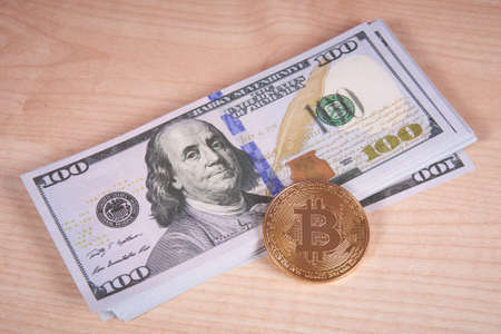 golden coin bitcoin and money on the tableの写真素材