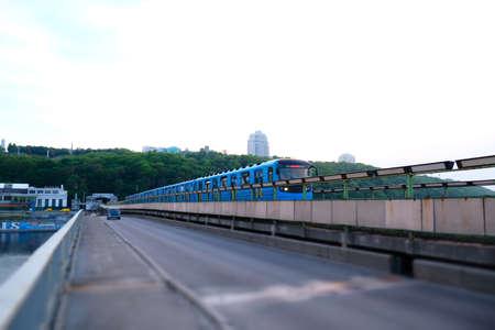 Metro train on the bridge in Kyivの写真素材