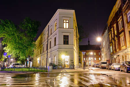 KRAKOW, POLAND - MAY 8, 2018: âafe in the street at night in Krakowの写真素材