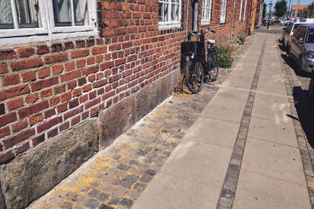 bicycle near the brick wall in Copenhagenの写真素材