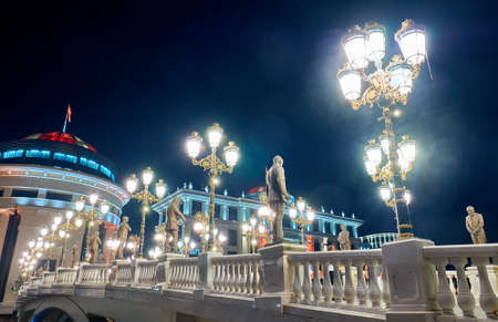SKOPJE, MACEDONIA -AUGUST 7 2018: Modern city center with many statues at nightのeditorial素材