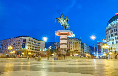 SKOPJE, MACEDONIA -AUGUST 7 2018: Modern city center with many statues at nightのeditorial素材