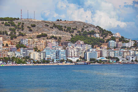 View of the shore of Saranda from the sea during the holiday season. Albaniaの写真素材