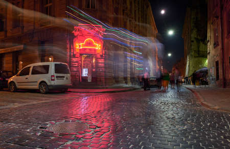 Lviv, Ukraine - September 20, 2018:  Crossroads from paving stones in the old city at nightの写真素材