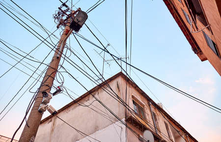 Wires on buildings in a residential area of Tirana, Albaniaの写真素材