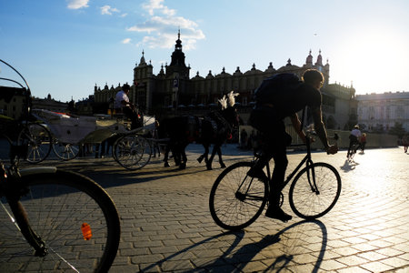 KRAKOW, POLAND - MAY 13, 2018:  Cyclist in the central square of the cityのeditorial素材