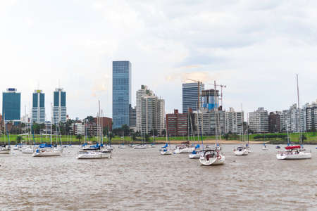 Costa del Rio de la Plata with small boats and sailboats in diving port in Uruguay