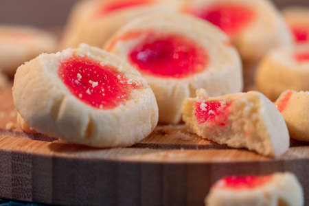 delicious baked biscuits with strawberry jelly for breakfast or family snackの写真素材