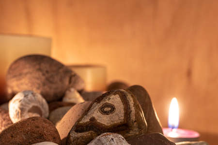 energetic stones, soft light and aromatic candles for yoga session