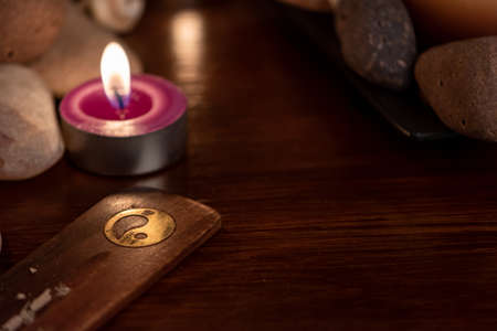 energetic stones, soft light and aromatic candles for yoga sessionの写真素材