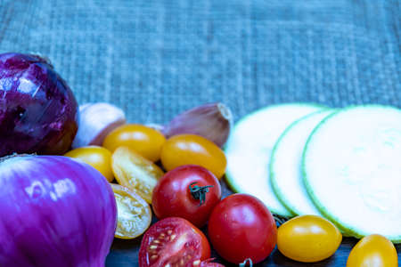 Colored tomatoes, carrots and other rich vegetables for a healthy salad