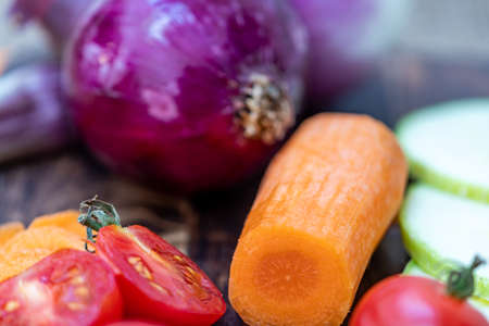 Colored tomatoes, carrots and other rich vegetables for a healthy saladの写真素材