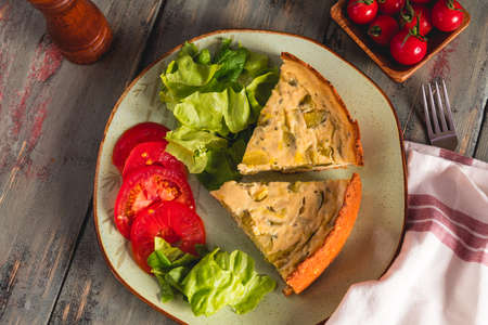 Homemade zucchini pie with salad