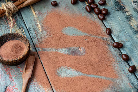dark chocolate of different shapes on rustic wood to eat at special partiesの写真素材