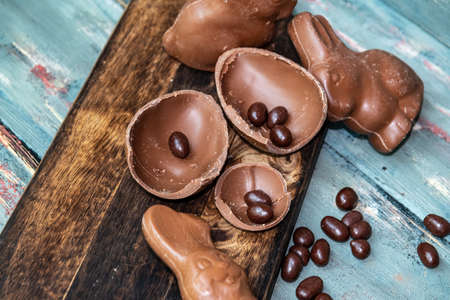 dark chocolate of different shapes on rustic wood to eat at special partiesの写真素材