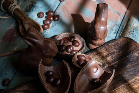 dark chocolate of different shapes on rustic wood to eat at special partiesの写真素材