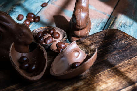 dark chocolate of different shapes on rustic wood to eat at special partiesの写真素材