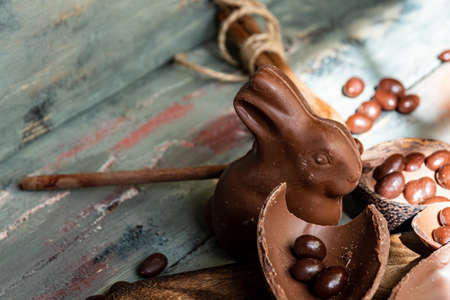 dark chocolate of different shapes on rustic wood to eat at special partiesの写真素材