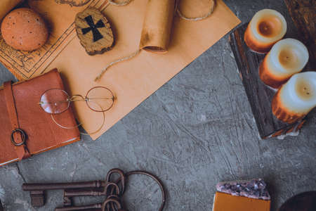 old keys and symbols in wood and with little natural lightの写真素材