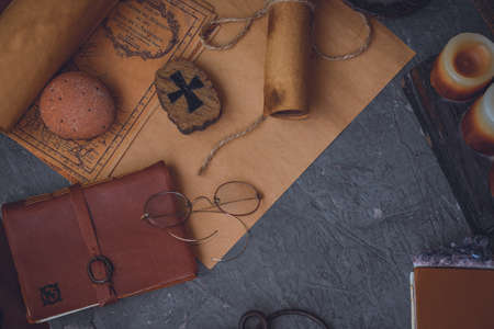 old keys and symbols in wood and with little natural lightの写真素材