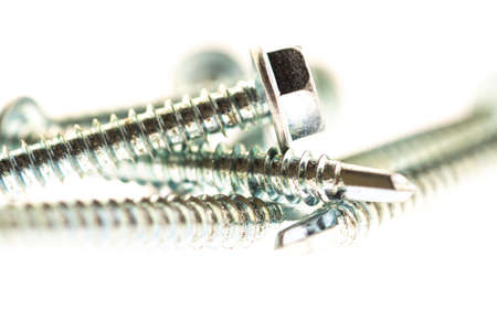 sheet metal and stainless steel screws together with nutsの写真素材